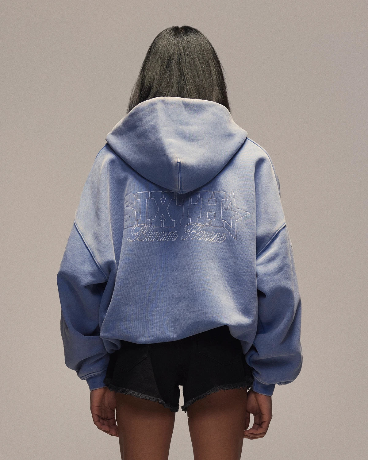 Sixth Bloom House Sixth Zip Through Hoodie Blue – back view, worn by woman