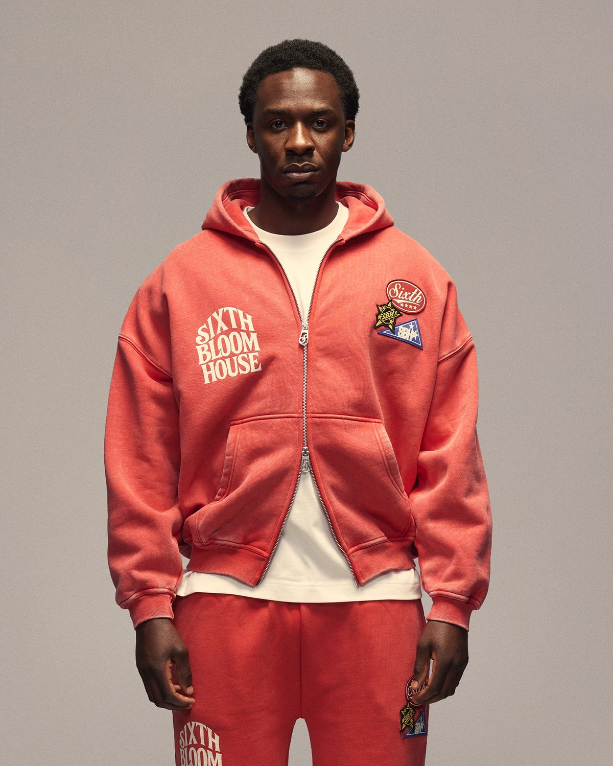 Sixth Bloom House Sixth Zip Through Hoodie Red – front view with the SIXTH BLOOM HOUSE print and Sixth patches